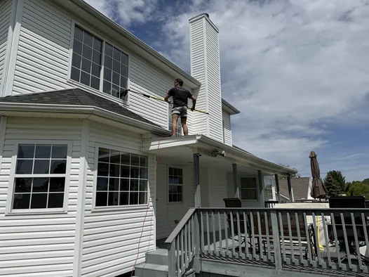 Exterior house wash in progress on a two-story Medina home